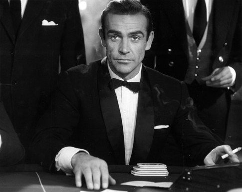 Man wearing a classic black tie tuxedo with proper fit and style