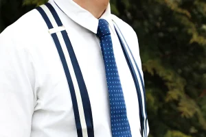 Gentleman wearing classic suspenders with a tailored suit showcasing timeless menswear elegance