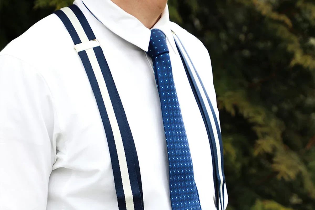 Gentleman wearing classic suspenders with a tailored suit showcasing timeless menswear elegance